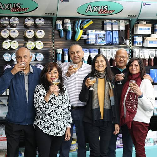 The Axus Decor shareholders in front of an Axus display