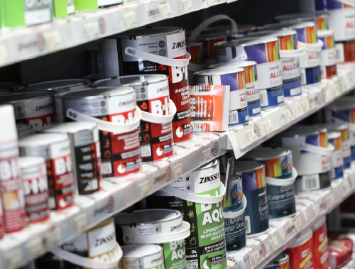 Decorator painting a wall