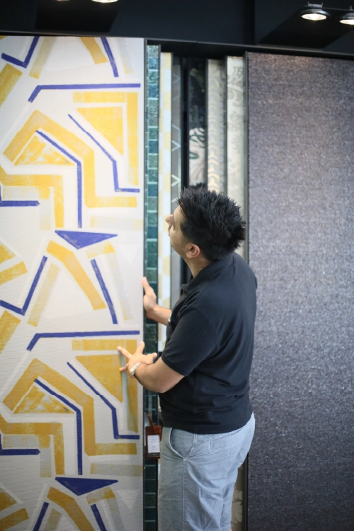 Designer Colours showroom with wallpaper books and interior displays